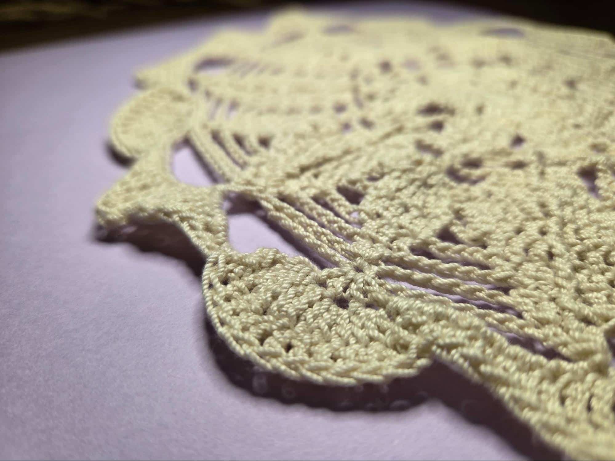 Thread weight doily Doily. Lacy work with thread yarn.