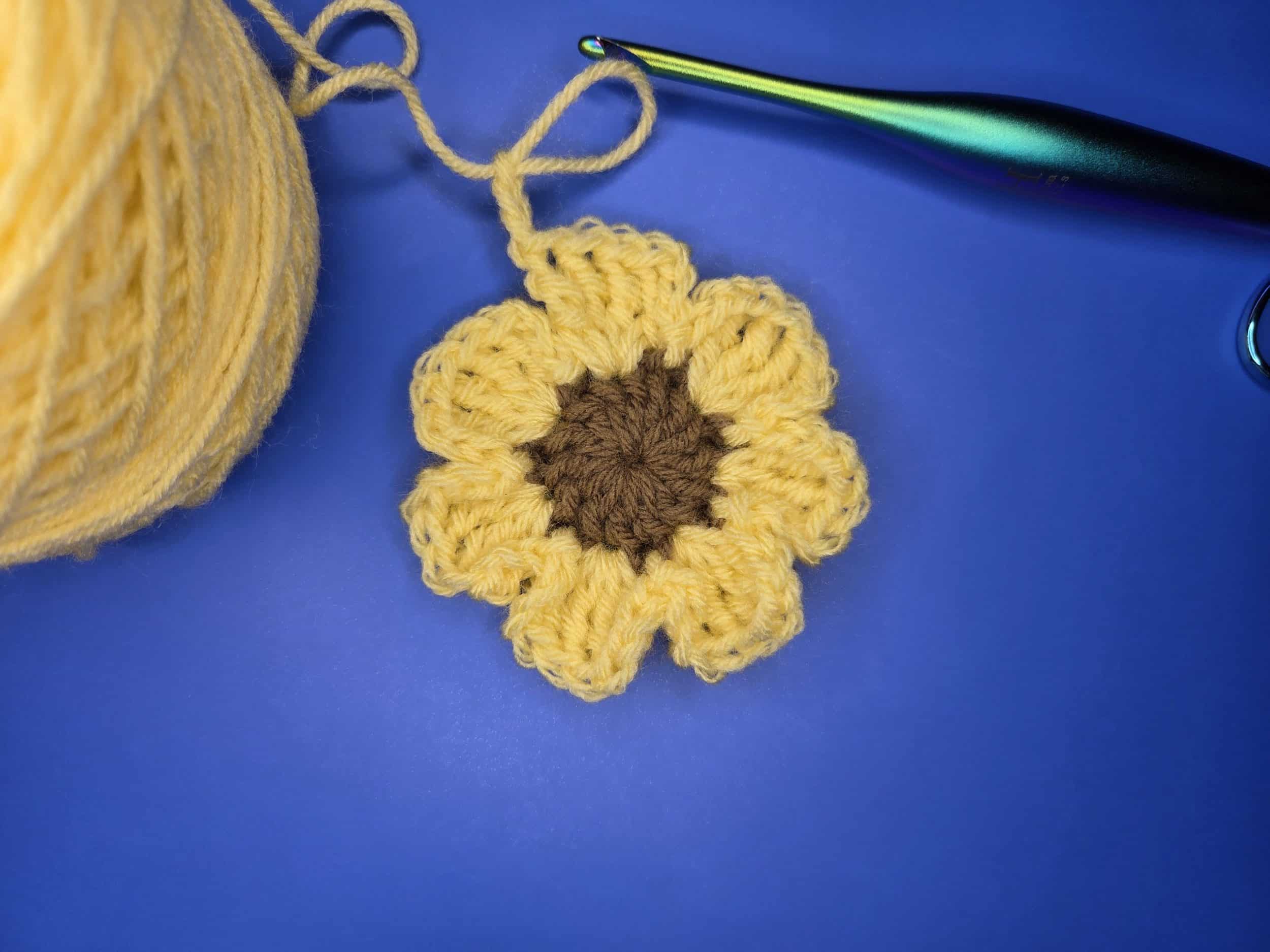 Completed round 2 of free flower granny square pattern.