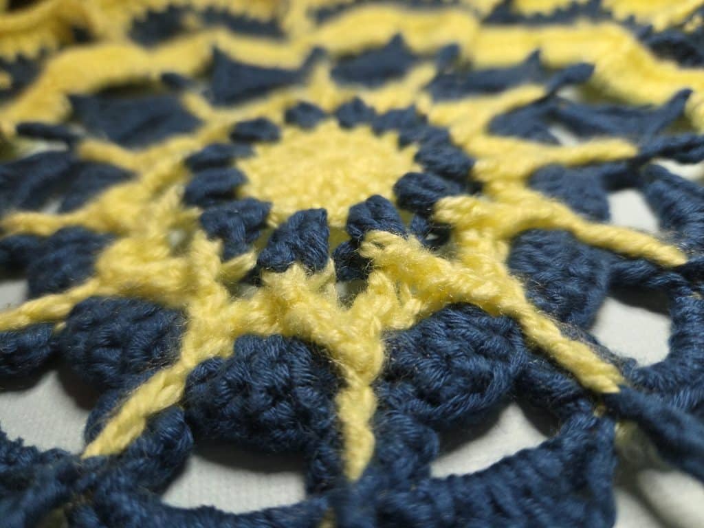 Crochet doily in a sun design